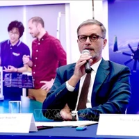 French Ambassador Olivier Brochet speaks at the press conference in Hanoi on December 11 to mark the 10th anniversary of the Paris Agreement on climate change and highlighting the COP30 outcomes. (Photo: VNA)