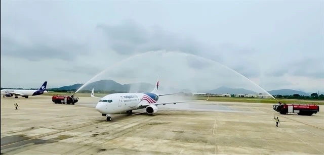 A plane from Malaysia Airlines is welcomed at Da Nang International Airport. The airport has been preparing for new growth in the decades ahead. (Photo courtesy of ACV Da Nang) 