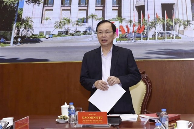Deputy Governor of the State Bank of Vietnam Dao Minh Tu speaks at the event. (Photo: sbv.gov.vn)