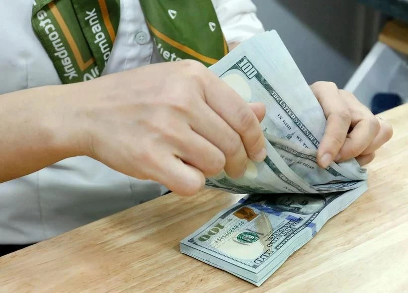 The daily reference exchange rate for the US dollar is set at 24,668 VND/USD on February 26 (Photo: VNA)