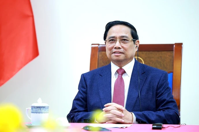Vietnamese Prime Minister Pham Minh Chinh at the phone talks with his Singaporean counterpart Lawrence Wong on December 18. (Photo: VNA)
