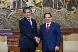 Prime Minister Pham Minh Chinh has a meeting with Japanese Ambassador to Vietnam Ito Naoki on the sidelines of an investment promotion conference in Thanh Hoa province on March 29 morning. (Photo: VNA)