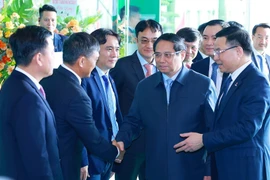 Prime Minister Pham Minh Chinh (second from left) attends Petrovietnam's year-end review conference (Photo: VNA)