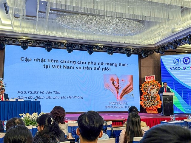 Associate Professor Dr Vu Van Tam, Vice President of the Vietnam Association of Obstetricians and Gynecologists, delivers a speech at the symposium. (Photo courtesy of the organiser)