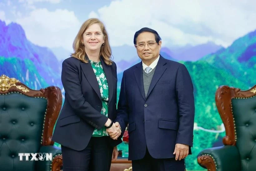 Prime Minister Pham Minh Chinh meets with Lynn Maxwell, Global Chief Commercial Officer at S&P Global Ratings, in Hanoi on February 26 (Photo: VNA)