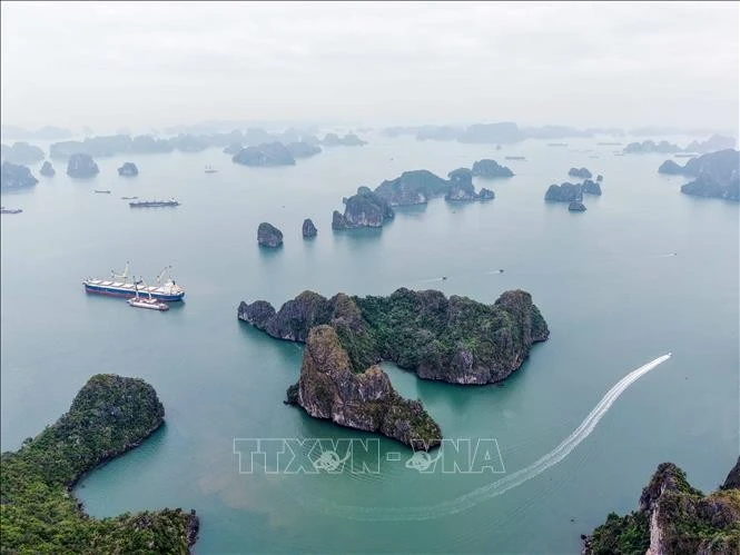Ha Long Bay has been listed as a UNESCO World Natural Heritage Site on three occasions. (Photo: VNA)