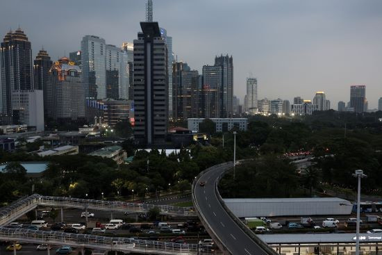High-rise buildings in the Sudirman Central Business District (SCBD) in South Jakarta are illuminated by the sunset on August 2, 2024. (Photo: Reuters)