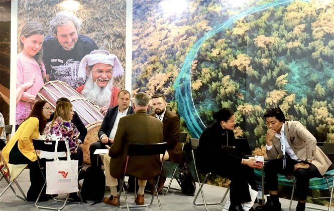 Foreign visitors at the ITB Berline 2025 show their interest in Vietnam's tourism products. (Photo: VNA)