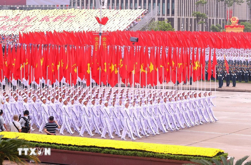 The formation featuring the Party flag and the national flag at the parade marking the 80th anniversary of the August Revolution and National Day on September 2, 2025 (Photo: VNA)