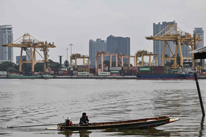 A boatman docks on the Samut Prakan side in front of Bangkok Port along the Chao Praya River in Samut Prakan province on April 8, 2025. (Photo: AFP)