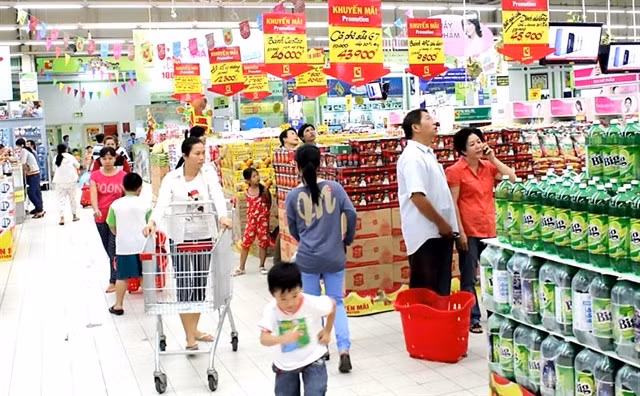 Customers at a supermarket in HCM City. The city faces rising inflation challenges. (Photo: VNA)