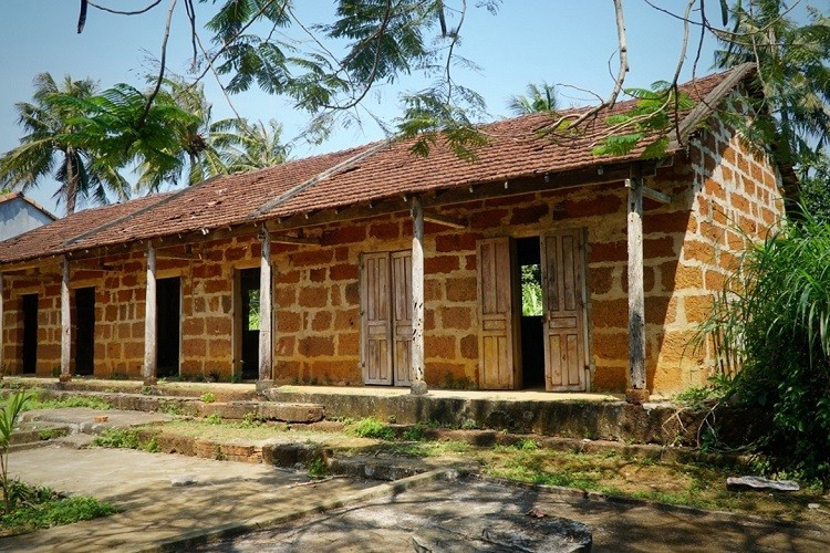 A long house built from laterite used to be a cultural place for people in An Loc Village, Binh Tri Commune, Binh Son District, more than 50 years ago. (Photo: Nhandan newspaper)