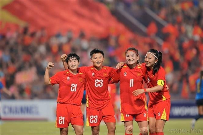 The Vietnam women’s football team celebrates after defeating Guam to secure a spot in the final round of the AFC Women’s Asian Cup. (Photo: VNA)