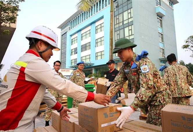 Members of Vietnam’s Level-2 Field Hospital No. 2 prepare equipment before departing for the UN peacekeeping mission (2019). (Photo: VNA)