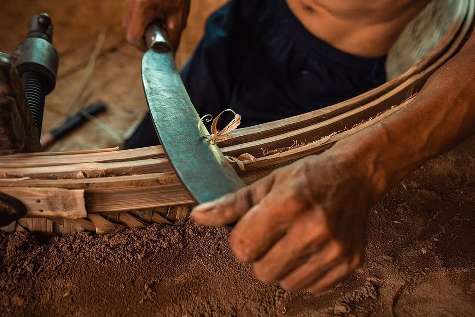 Every step of the boat-making process is carefully performed by hand. (Photo: VNA)