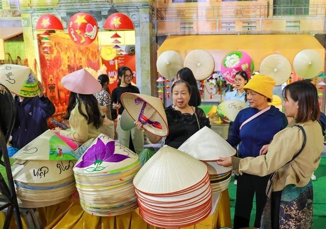 A booth displaying products from Chuong Village – famous for its traditional conical hats. (Photo: VNA)