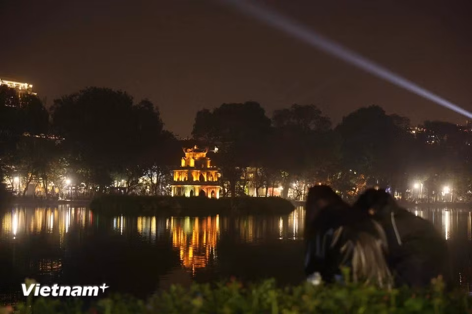 Turtle Tower glows in the night on New Year’s Eve. (Photo: Hoai Nam/Vietnam+)