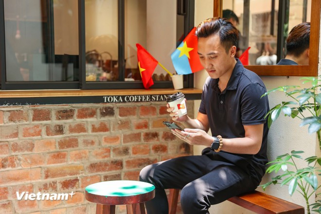 Tuan Viet, a resident of My Dinh, Hanoi, says he feels proud and moved while visiting cafés decked out in red and yellow flags in the final days of April — a historic moment for the entire country. (Photo: Hoai Nam/Vietnam+)