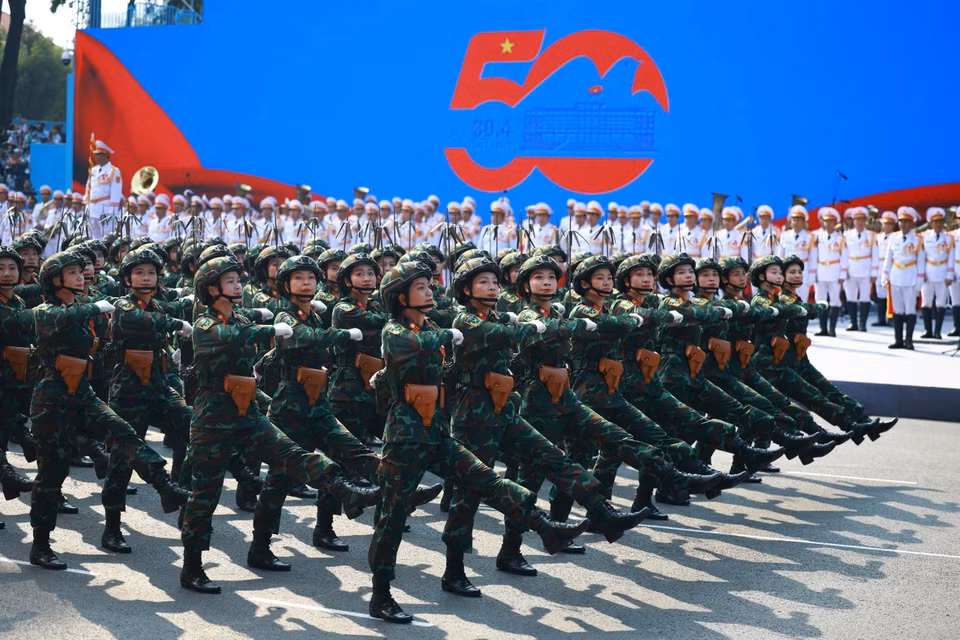 The female Signal Corps officers march past the grandstand. Photo: VNA