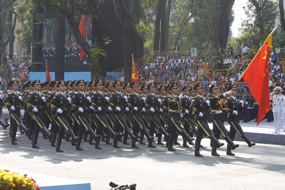  The Chinese People's Liberation Army marches past the grandstand. Photo: VNA