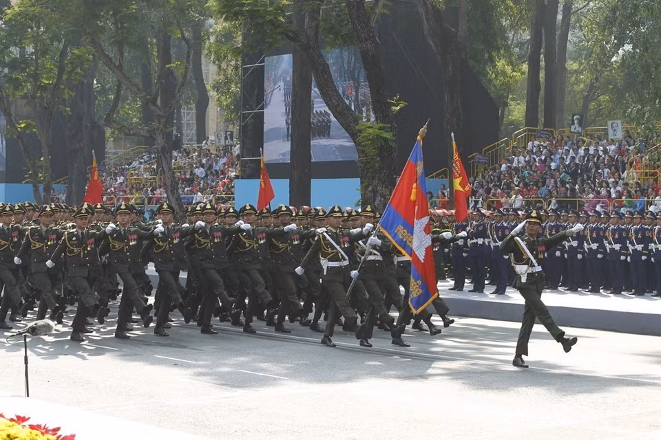 The Royal Cambodian Army marches past the grandstand. Photo: VNA