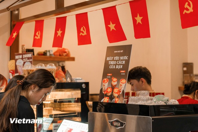 Cafés across the capital feature elaborate decorations with the Party flag, national flag, and the flag of the National Liberation Front for South Vietnam. (Photo: Hoai Nam/Vietnam+)
