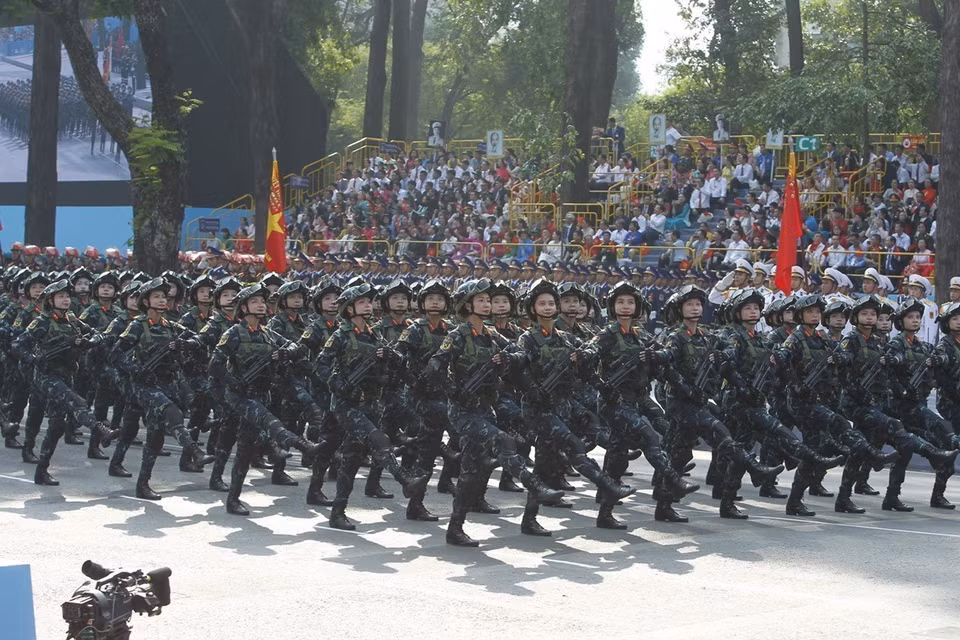 The female Guerilla fighters march past the grandstand. Photo: VNA