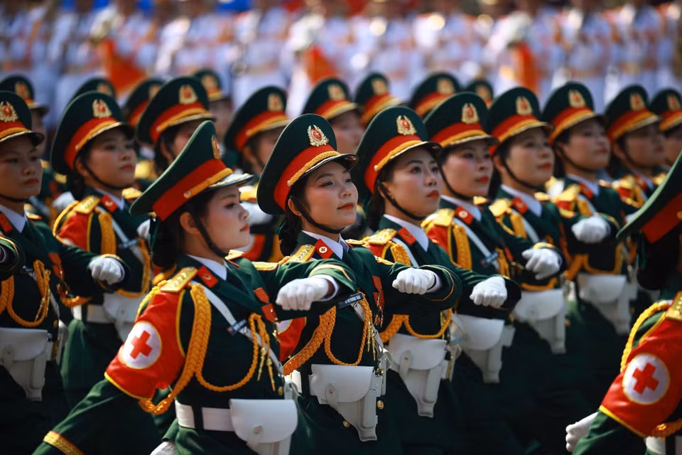 The female Military Medical officers march past the grandstand. Photo: VNA