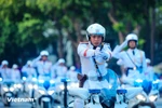 Spectacular motorcycle escort performance by Vietnamese police force