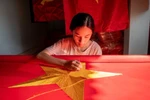 Flag-making village awash in red ahead of National Day