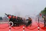 Thousands of people gather on Le Loi Street, District 1 to watch the parade. (Photo: VNA)