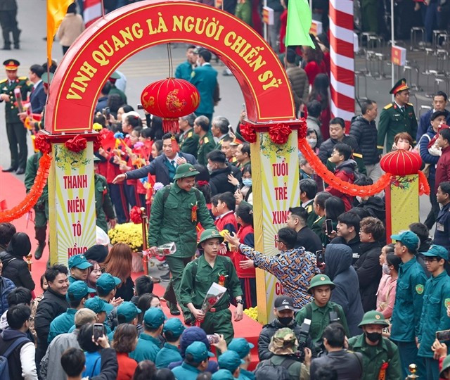 Young people embark on their national service duties on February 13 in Hanoi. (Photo: VNA) 