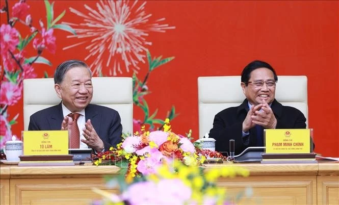 Party General Secretary To Lam (left) and Prime Minister Pham Minh Chinh at the gathering on February 3. (Photo: VNA)