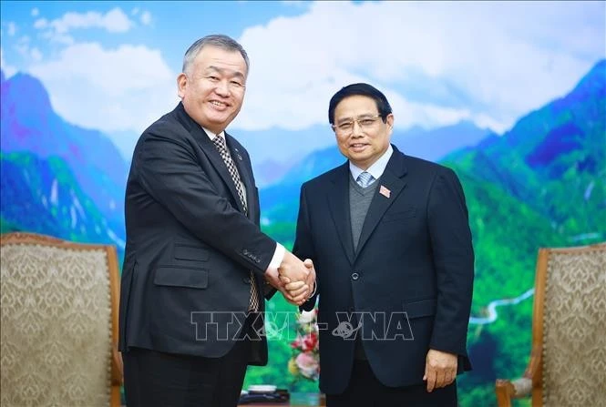 Prime Minister Pham Minh Chinh (R) and Executive Officer and President of Yamato Holdings Nagao Yutaka at their meeting in Hanoi on February 17. (Photo: VNA)