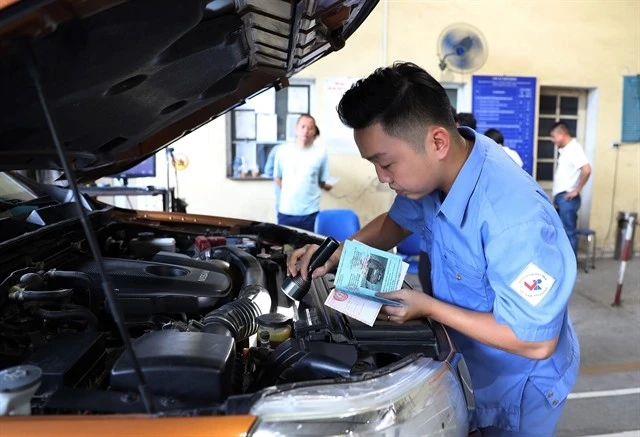 An car is inspected at a vehicle inspection centre in Hanoi. (Photo: VNA) 