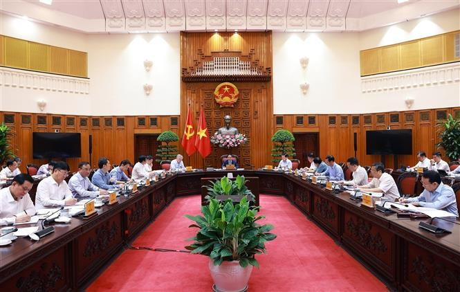 At the exclusive meeting to seek solutions to the US's new tariff policy, chaired by PM Pham Minh Chinh in Hanoi on May 6. (Photo: VNA)