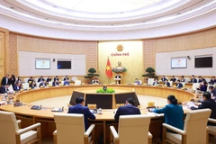 An overview of the Government meeting to assess the regional and global economic situations (Photo: VNA)