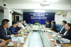 At the working session between representatives from Hanoi Financial and Banking University and the Lao Ministry of Education and Sports. (Photo: VNA)