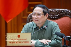 Prime Minister Pham Minh Chinh speaks at the meeting between standing Government members and representatives of ministries, agencies and Phu Tho province (Photo: VNA)