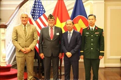 DPAA Director Kelly McKeague (far left) poses for a photo with Vietnamese Ambassador to the US Nguyen Quoc Dung (second from right) at a war remembrance handover ceremony in Washington D.C. on July 15, 2025. (Photo: VNA)