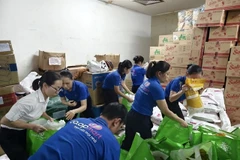 Co.opmart Hue staff pack relief goods to ensure they reach those in need as quickly as possible. (Photo courtesy of Saigon Co.op)