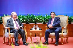 Prime Minister Pham Minh Chinh (R) meets with United Nations Secretary-General Antonio Guterres in Hanoi on October 25. (Photo: VNA)