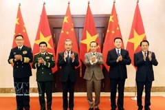 The Vietnamese and Chinese ministers of foreign affairs, national defence and public security pose for a photo at the first ministerial-level “3+3” strategic dialogue in Hanoi on March 16. (Photo: VNA)
