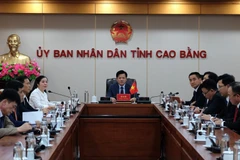 The Cao Bang delegation attends the teleconference with the People’s Government of China’s Guangxi Zhuang Autonomous Region. (Photo: VNA)