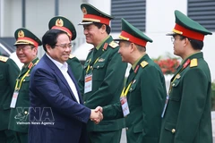 Prime Minister Pham Minh Chinh meets with leaders of the Viettel Military Industry and Telecoms Group. (Photo: VNA)