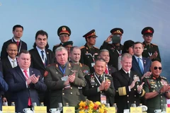 Representatives from the Ministries of Defence, military attachés of various countries, and international organisations attend the opening ceremony of the Vietnam International Defence Expo. (Photo: VNA)