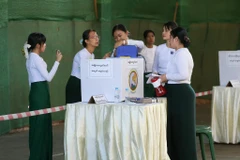 Officials of the Union Election Commission (UEC) count printed records of votes during the third phase of the general election at a polling station in Yangon, Myanmar, Jan. 25, 2026. (Photo: xinhua)