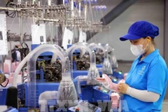 Sock production line for export at SUNJIN AT&C VINA Co., Ltd., Chan May - Lang Co economic zone, Hue city. (Photo: VNA)