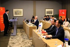 The seminar attracts numerous investors and industry partners, including representatives from the International Semiconductor Industry Group, Qualcomm, and Marvell. (Photo: VNA)