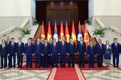 Party General Secretary To Lam (7th from right) and Party General Secretary and President of Laos Thongloun Sisoulith (6th from right) co-chair the High-Level Meeting between the Communist Party of Vietnam and the Lao People’s Revolutionary Party on December 2, 2025. (Photo: VNA) 